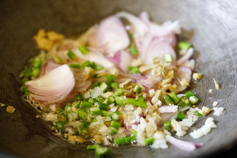 chopped onions and garlic in a wok