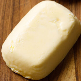 block of butter on brown wooden board