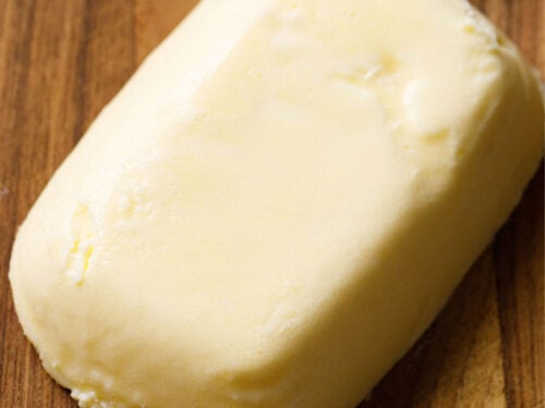 block of butter on brown wooden board