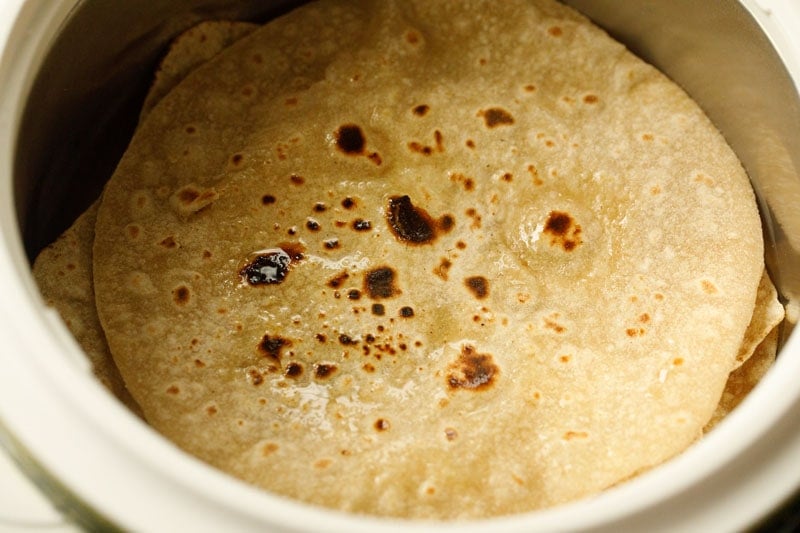 ghee smeared on chapati in a roti basket