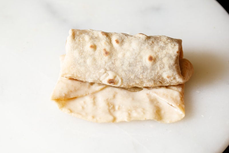 flour paste added to exposed edge to seal tortilla to itself