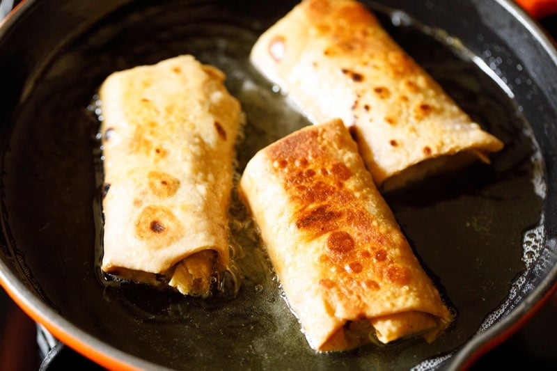 flip the chimichangas again and continue cooking until golden brown on all sides