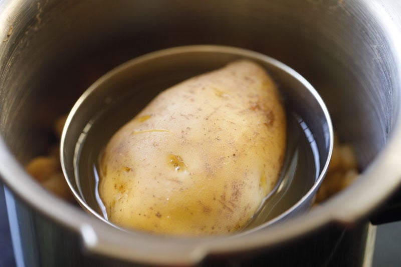 cooked potato and chickpeas in a pressure cooker