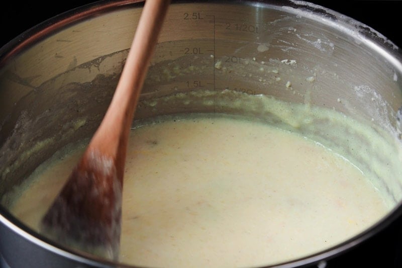 phirni being stirred with wooden spoon