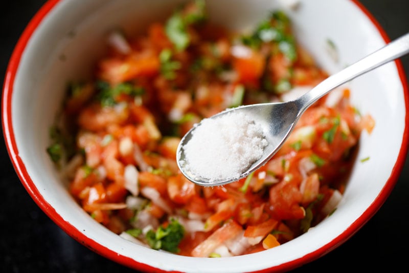 teaspoon of salt being added