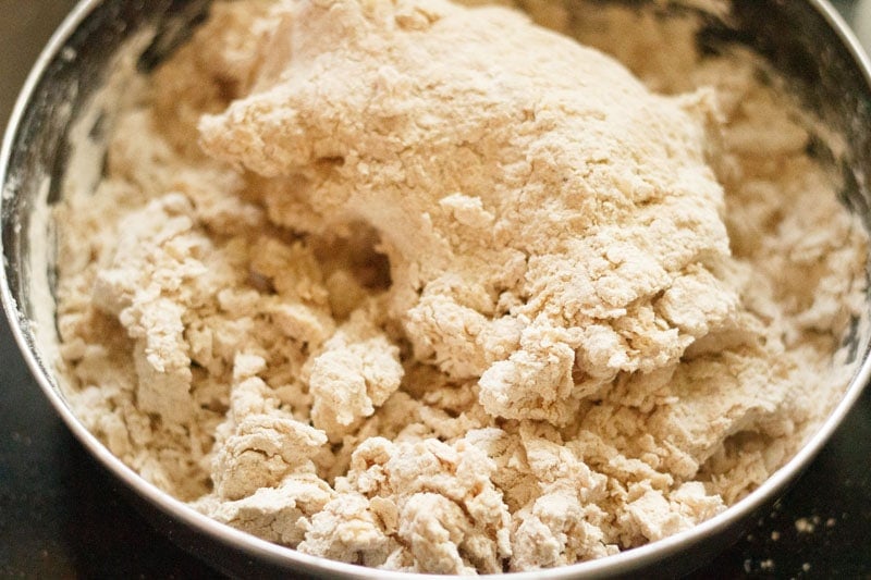 initial stage of kneading dough for roti - the dough is quite craggy and hasn't formed a single piece