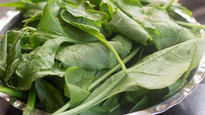 rinsed spinach leaves in a bowl