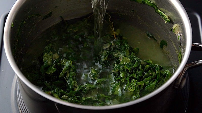 adding water to the pan