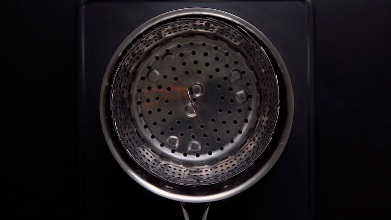 steamer pan placed on the water in the saucepan