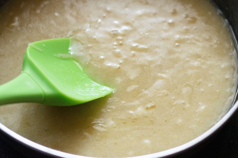 oil being mixed with banana puree in bowl