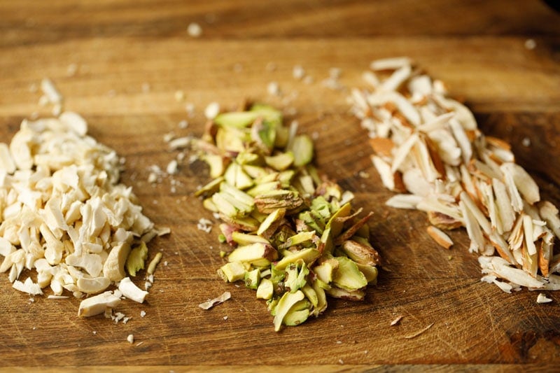 chopped nuts on wooden chopping board