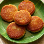 corn cutlet or corn patties on a green plate