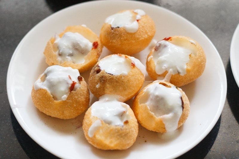 stuffed puris topped with curd to make dahi puri