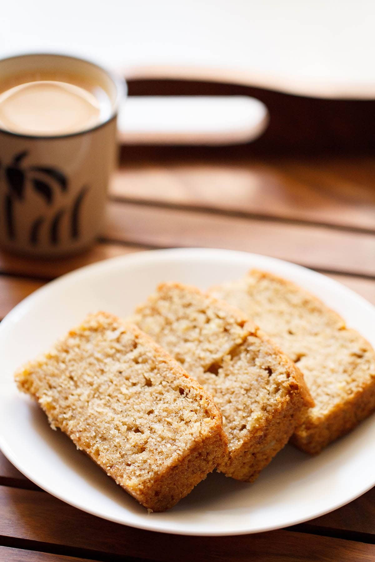 three banana bread slices on a white plate