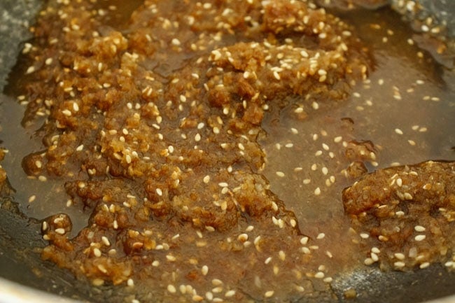 liquid mixture of modak filling ingredients cooking in pan