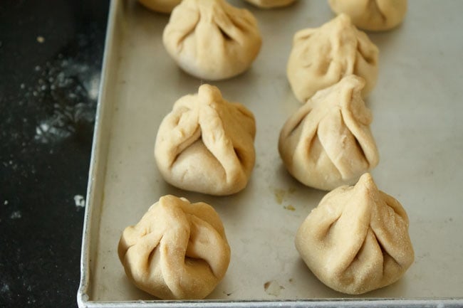 shaped modak kept on a tray to be fried later