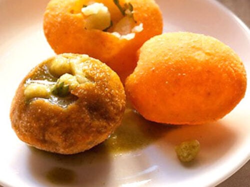 pani puri served on a white plate