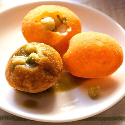 pani puri served on a white plate