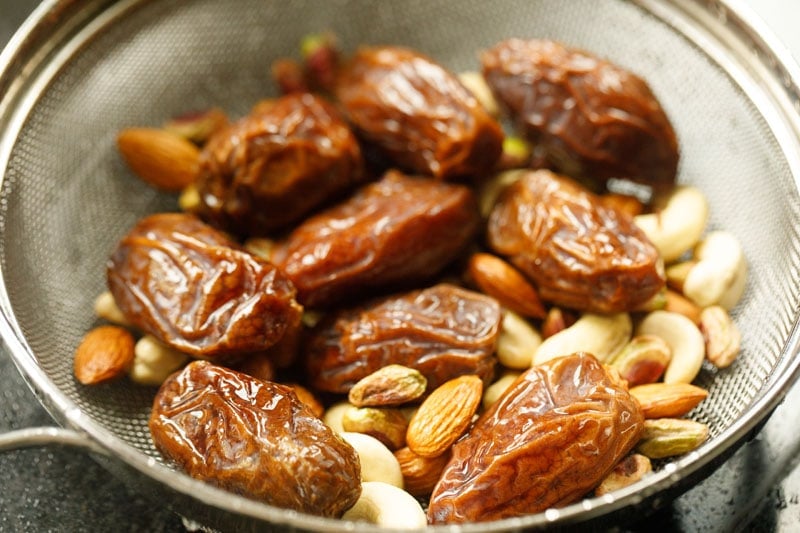 dates and nuts in a mesh strainer