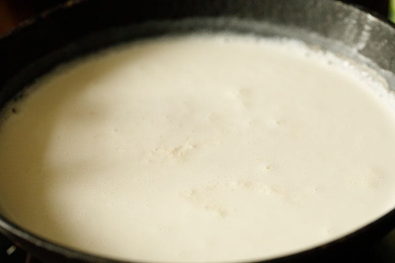 milk bubbling around edges of pan and lightly simmering