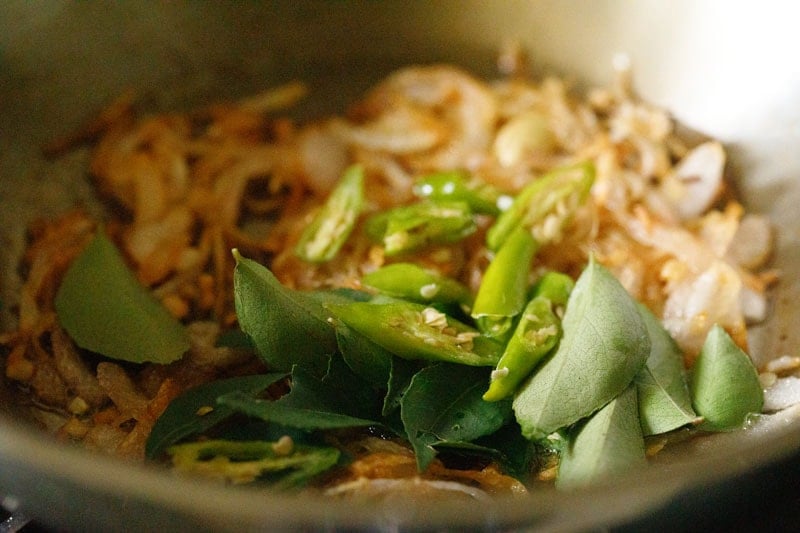 chilies and curry leaves added to sautéed onions