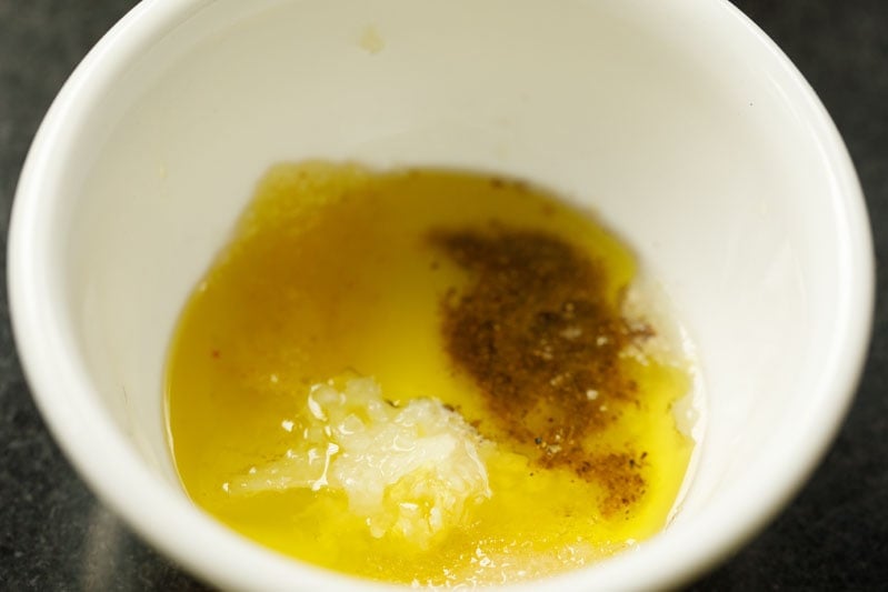 garlic, pepper, sugar and salt added to vinaigrette bowl