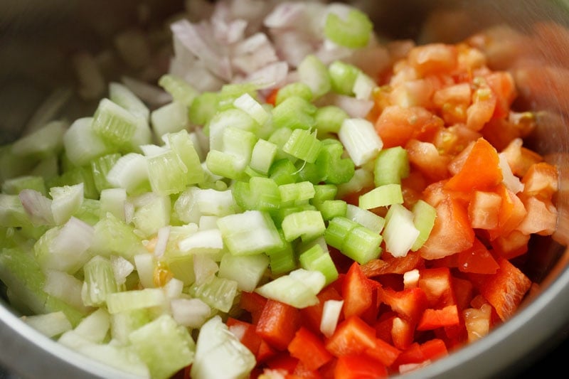 chopped vegetables added to large mixing bowl