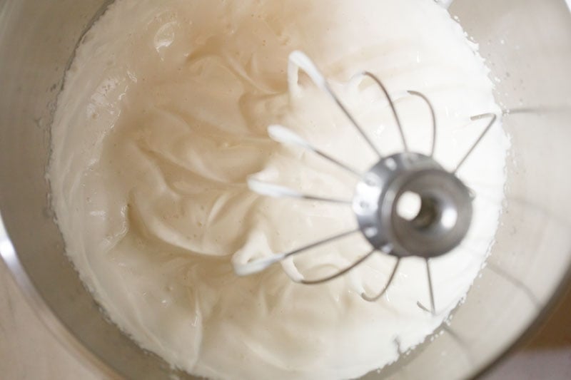whipped cream in a bowl with soft peaks