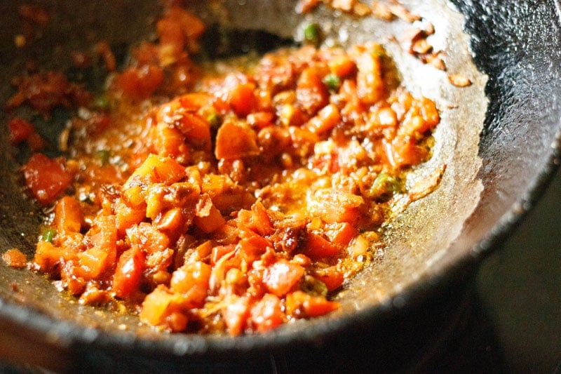 sautéing masala mixture in wok