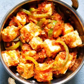 closeup shot of kadai paneer in a small kadai (Indian wok)