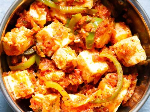 closeup shot of kadai paneer in a small kadai (Indian wok)