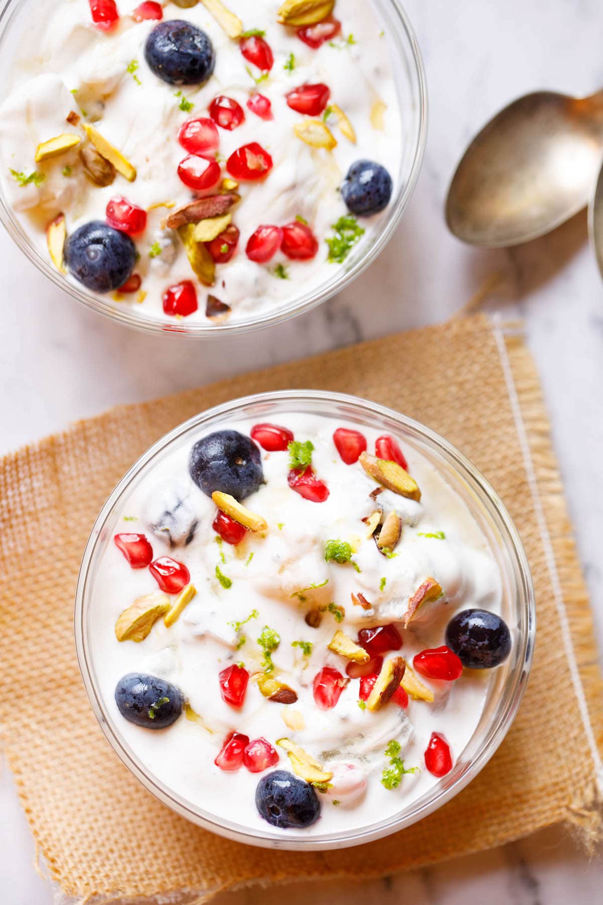 fruit cream in two glass bowl on a burlap