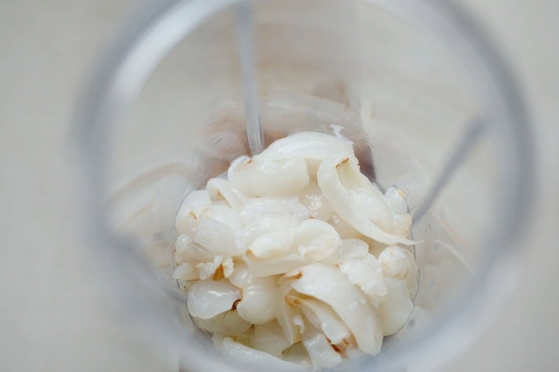 Chopped litchi in a blender.