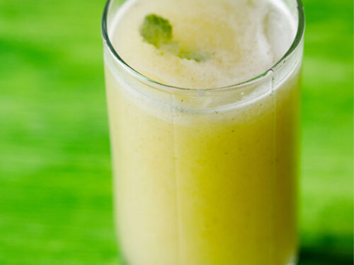 aam panna in glass on a green table.