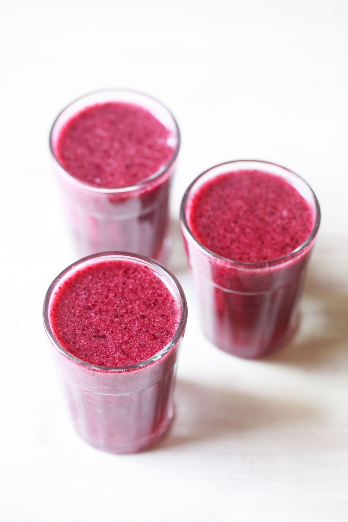 blueberry juice served in glasses.