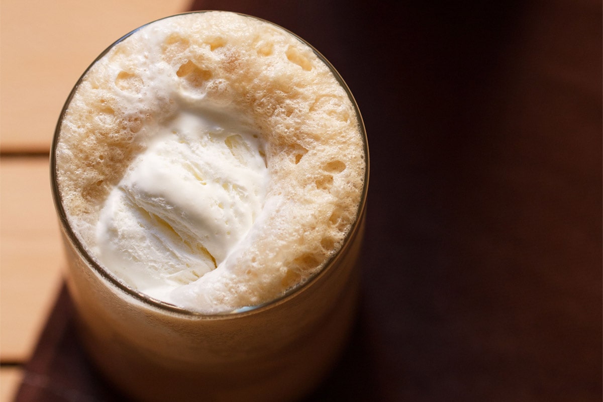 close up and overhead shot of coffee shake on a sunny table