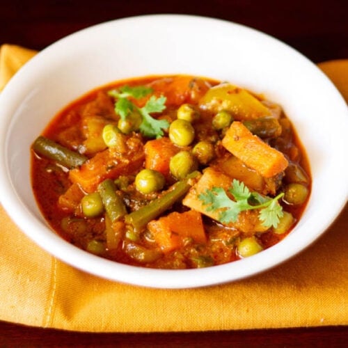 veg kolhapuri served in a white bowl.