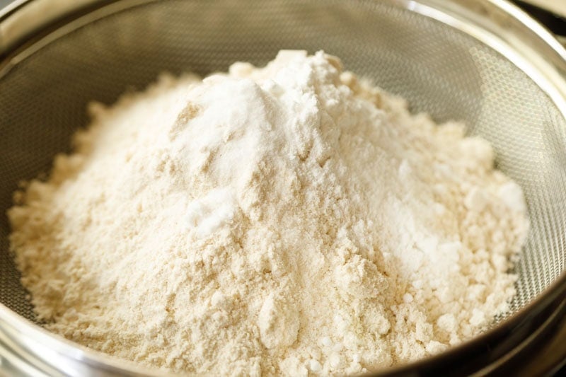 date cake dry ingredients over a fine mesh sieve.