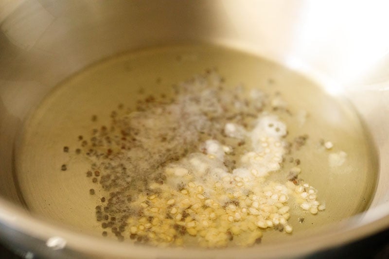 lentils and mustard in hot oil.