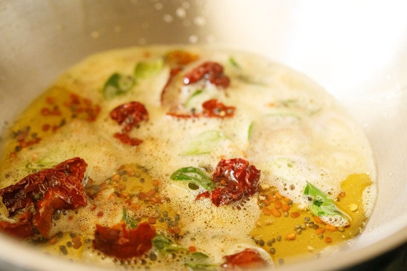 red chillies and curry leaves in oil.