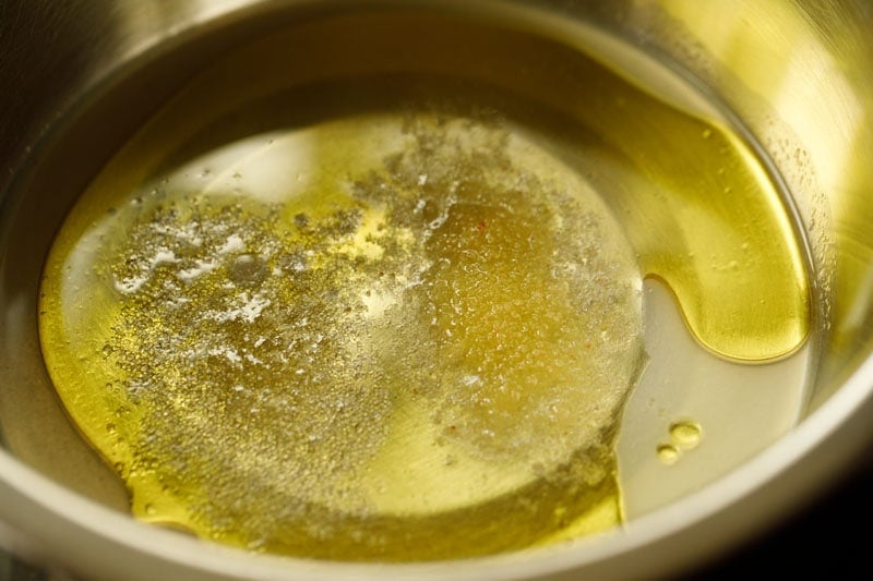 olive oil, lemon juice, raw sugar and salt added to a mixing bowl. 