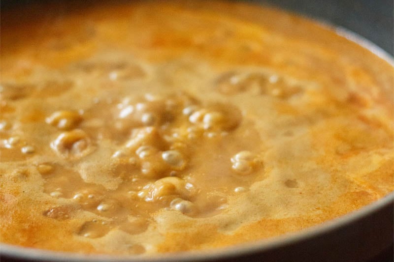 simmering kala vatana sambar in pan.