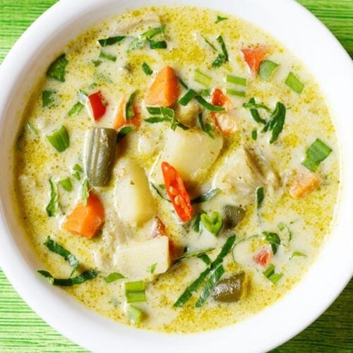 thai green curry served in white bowl.