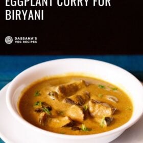 White bowl of bagara brinjal on a white plate on a blue table with text layovers