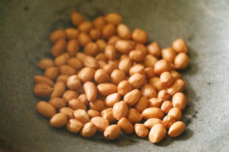 roasting peanuts to make bharli vangi.