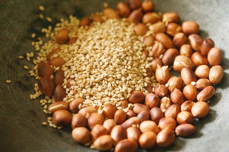 sesame seeds mound on roasted peanuts.