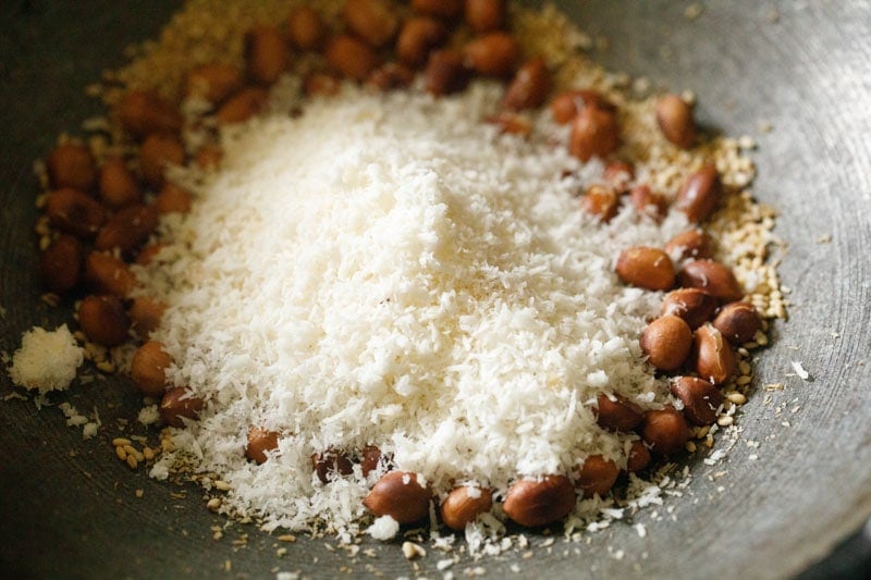 mound of desiccated coconut on peanuts.