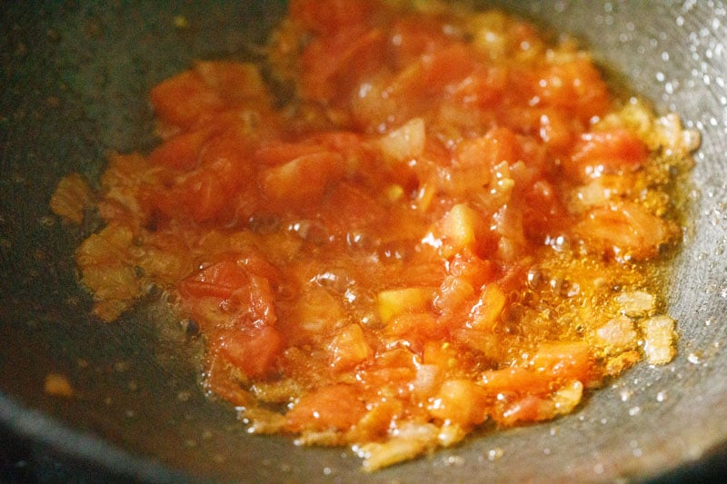 softened tomatoes in pan.