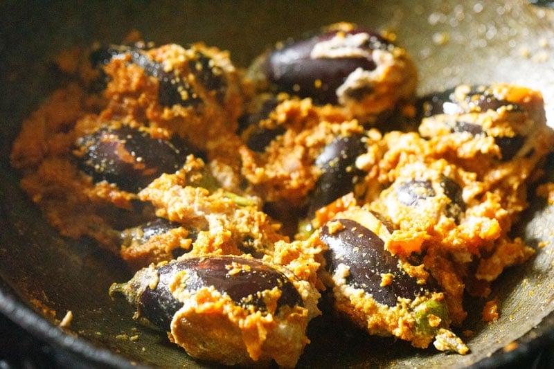 stuffed brinjals mixed with the sautéed masala paste.