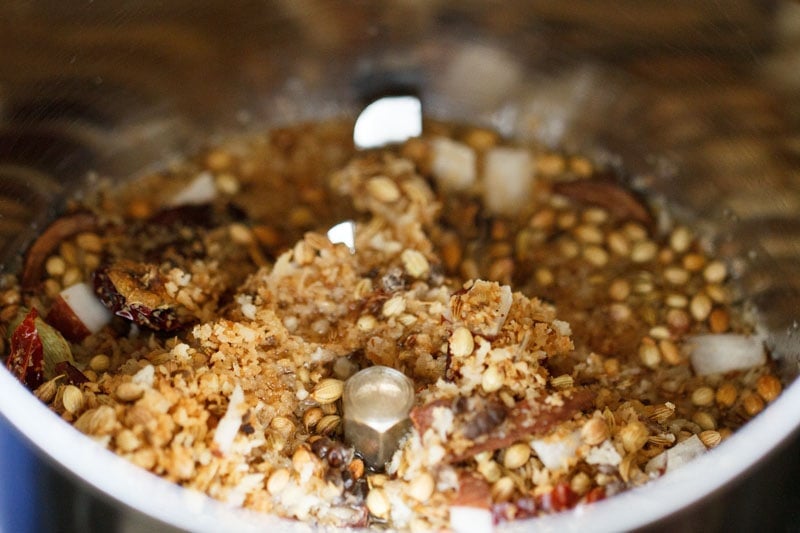 cooled coconut-spice mixture added to a wet grinder jar. 